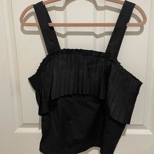 Black sleeveless TIBI top.